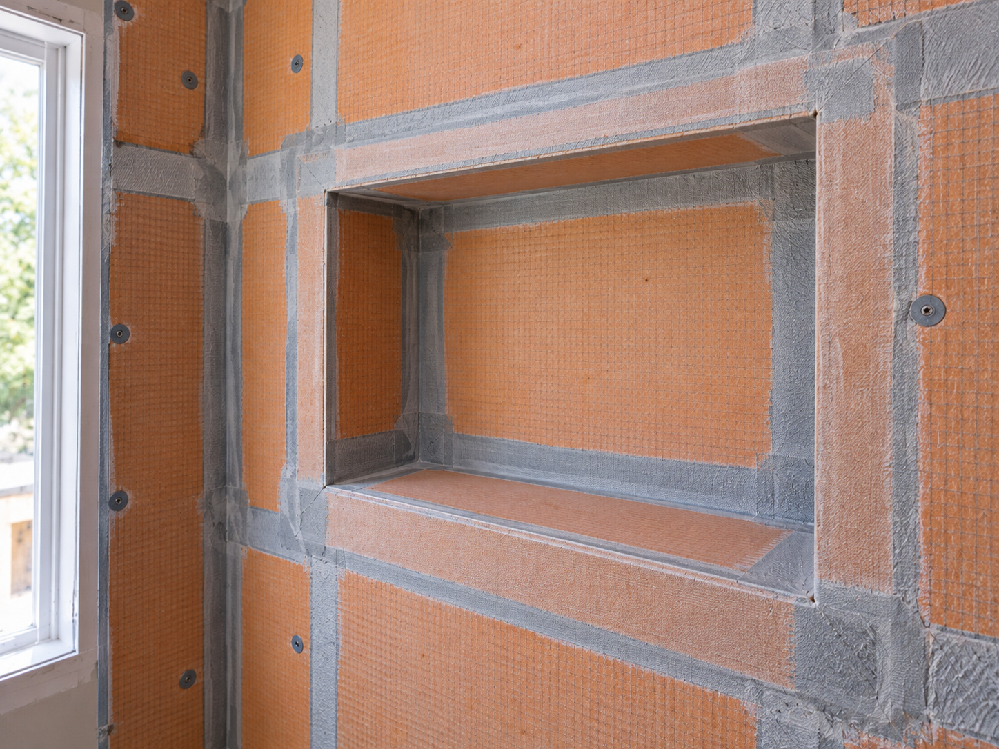 Shower niche waterproofing during a South Jersey bathroom remodel